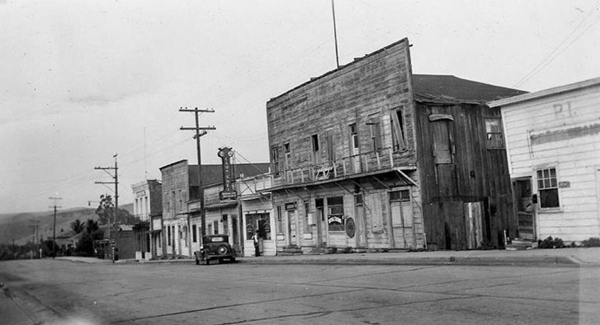 San Luis Obispo’s historic Chinatown, Palm Street. In foreground is where today’s parking garage is, background shows Ah Louis Store.