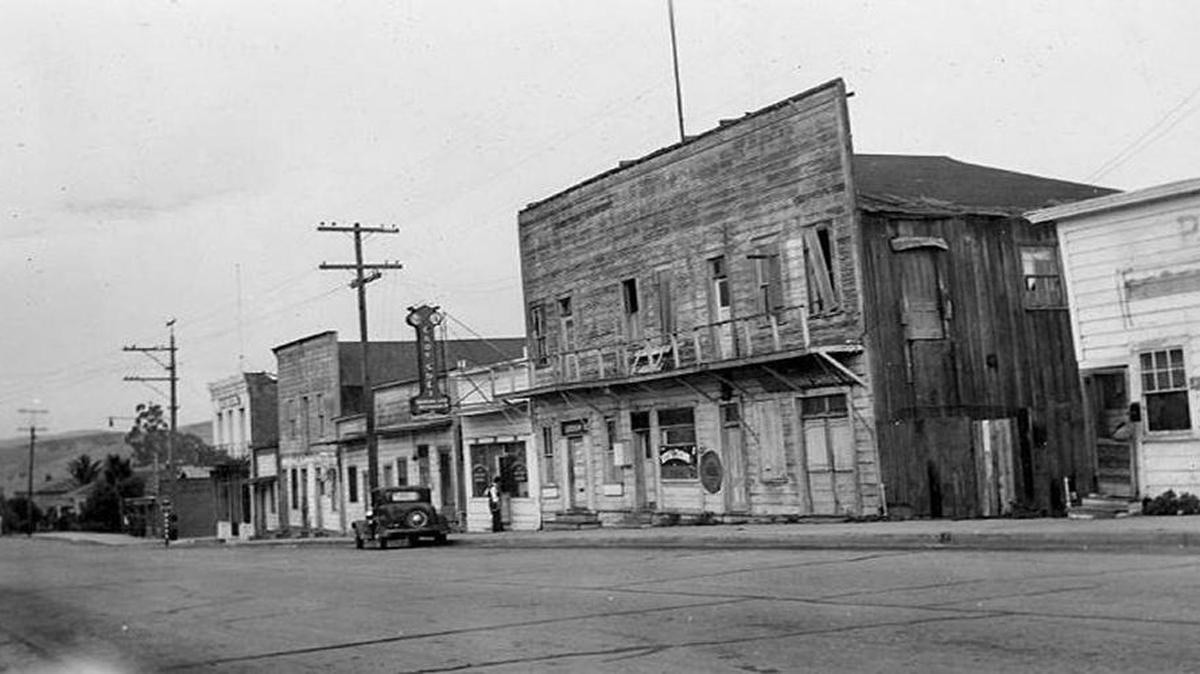 San Luis Obispo’s historic Chinatown, Palm Street, in foreground is where today’s parking garage is, background shows Ah Louis Store.