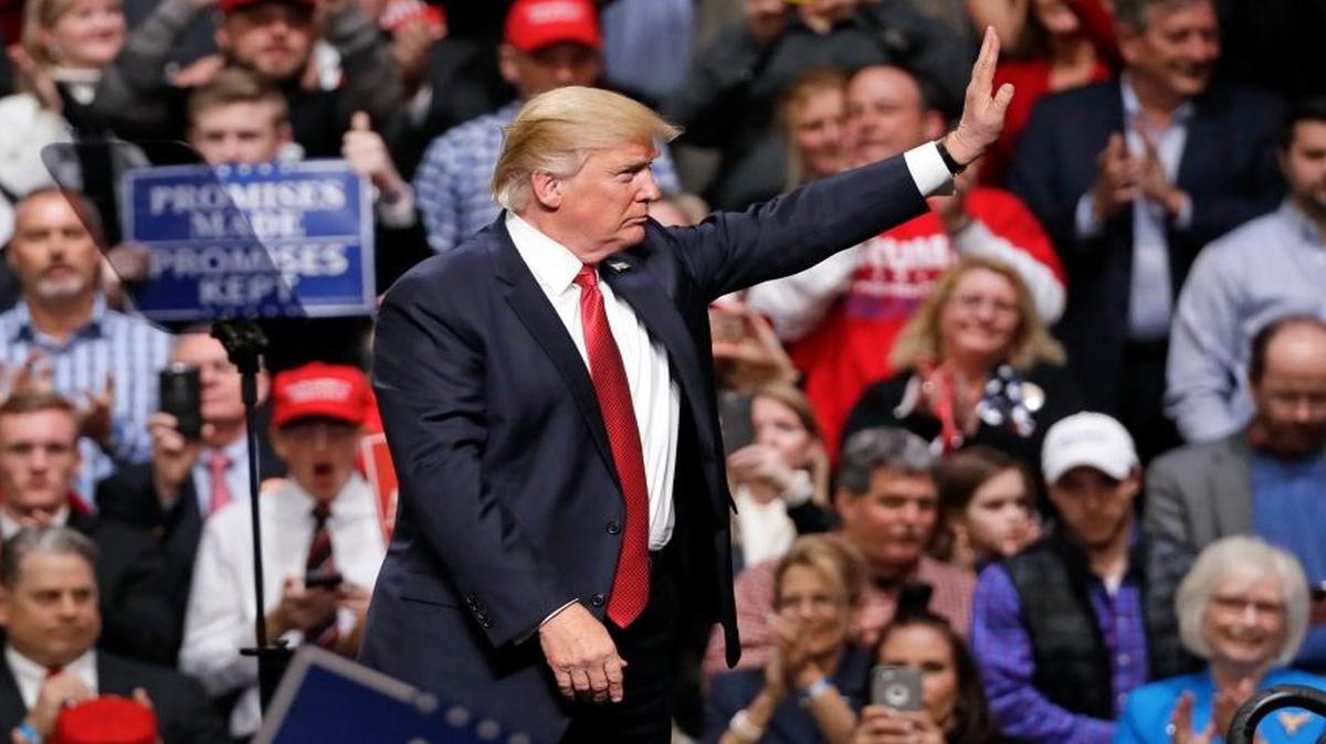 President Donald Trump waves to the crowd after speaking at a rally Wednesday, March 15, 2017, in Nashville, Tennessee.