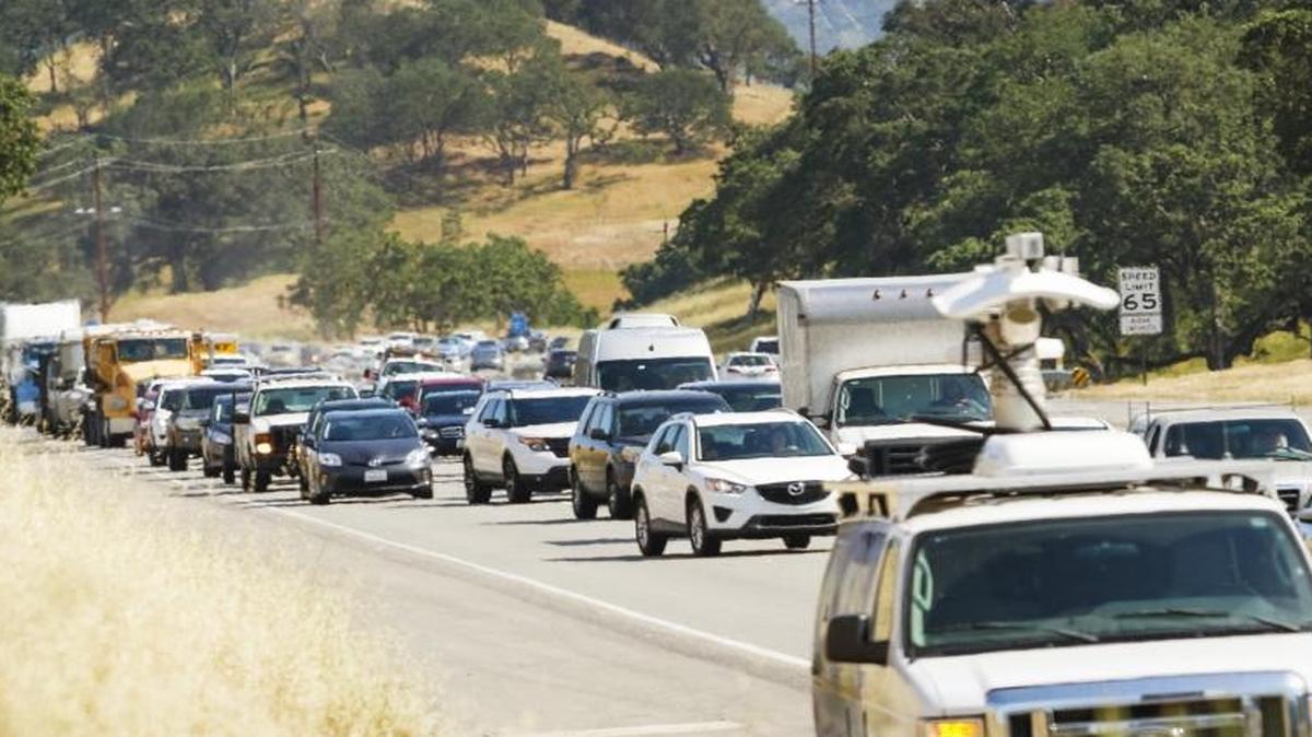 Traffic backs up after a truck and a compact car were involved in a collision on northbound Hwy. 101 just south of Atascadero in May.