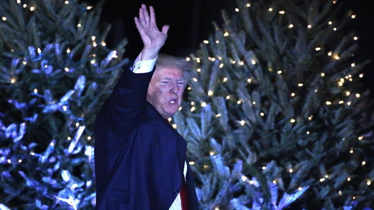 President-elect Donald Trump responds to cheering supporters in front of a Christmas-themed backdrop at a rally in Orlando, Fla., on Friday, Dec. 16, 2016.