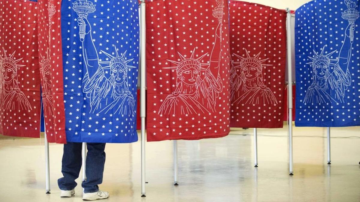 A voter marks a ballot.