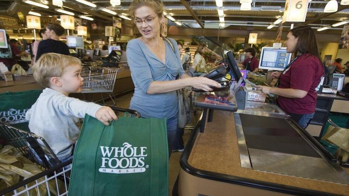 Customers Pam King and her son Rhys, 2, shop for organic groceries at Whole Foods Market Arroyo Parkway store in Pasadena, Calif. in this Nov. 7, 2007 file photo.