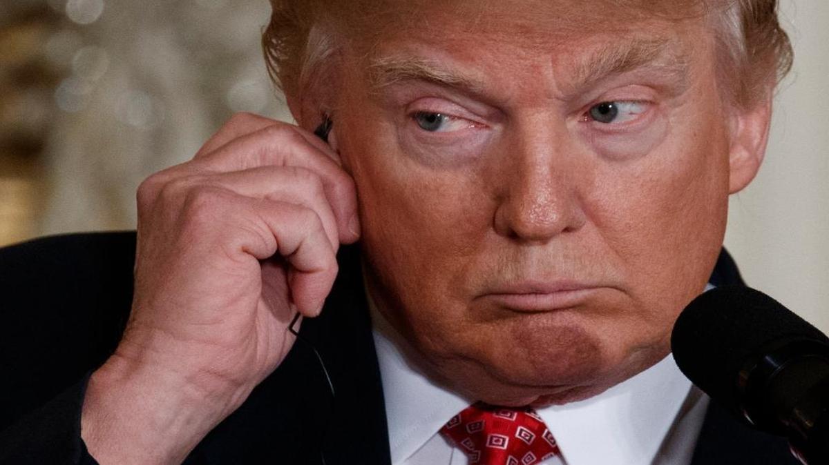 President Donald Trump listens to a translation as Japanese Prime Minister Shinzo Abe speaks during their joint news conference, Friday, Feb. 10, 2017, in the East Room of the White House in Washington.