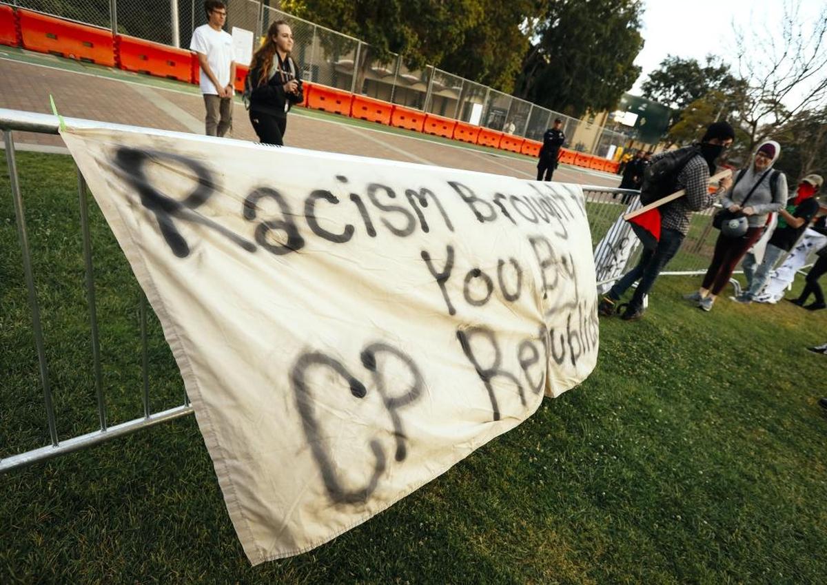 A small group of protesters put up signs in response to Milo Yiannopoulos’ visit to Cal Poly, San Luis Obispo, on April 26, 2018.
