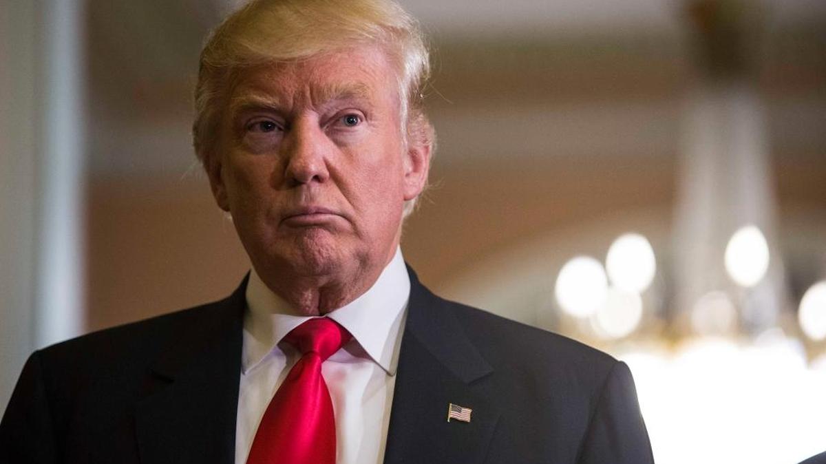 President-elect Donald Trump listens to a question Thursday on Capitol Hill in Washington.