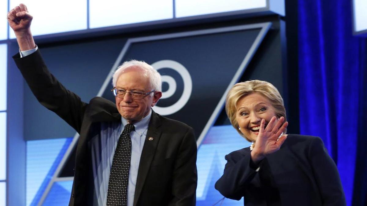 Democratic presidential candidates Hillary Clinton and Sen. Bernie Sanders, I-Vt., stand together before the start of the Univision, Washington Post Democratic presidential debate at Miami-Dade College in Miami on March 9.