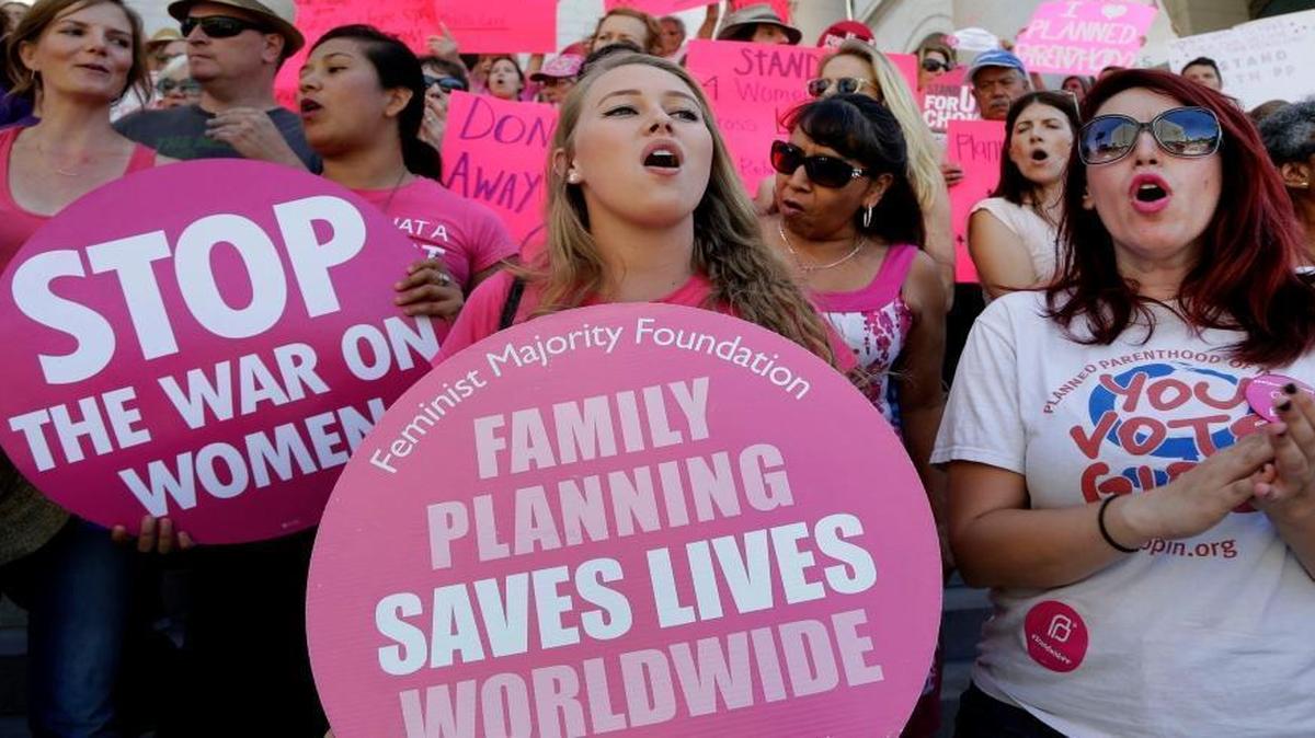 Planned Parenthood supporters in Los Angeles rally in 2015 for women’s access to reproductive health care on National Pink Out Day. Republicans in Congress this week announced plans to strip the group of federal funding.