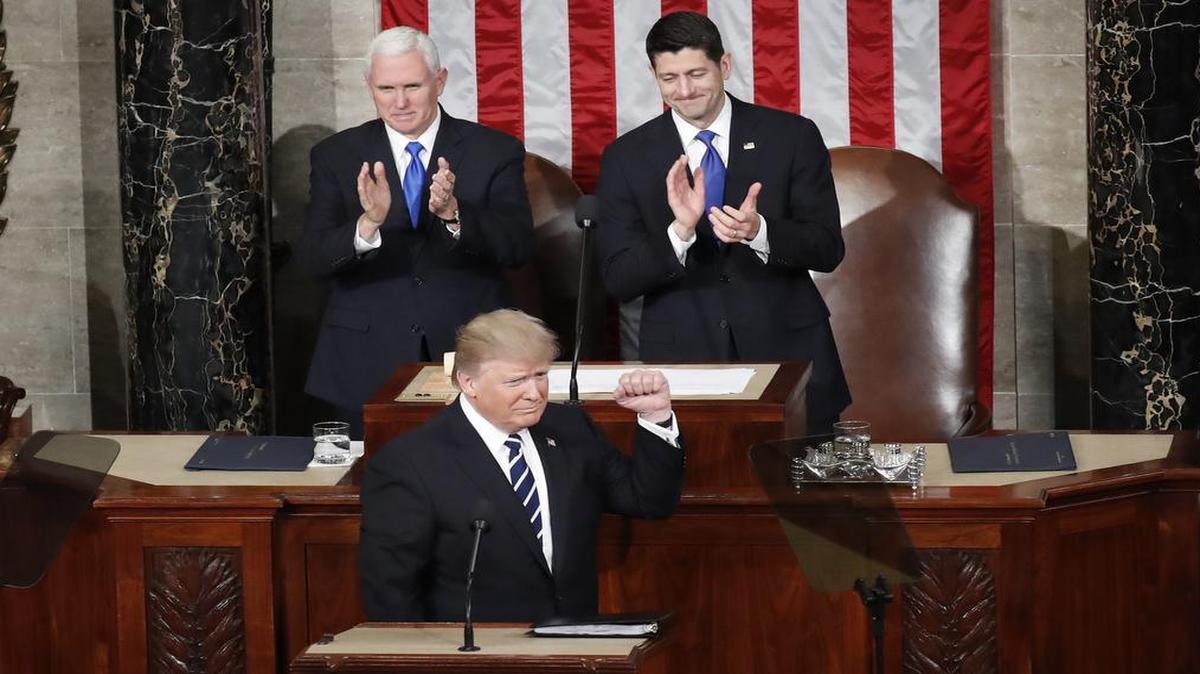 President Donald Trump pumps his fist before starting his first address to Congress on Tuesday night.
