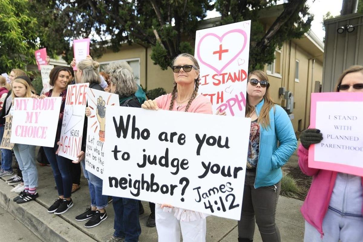 Demonstrators stood outside the San Luis Obispo Planned Parenthood to support the national health care organization, Saturday, February 11, 2017, as a counter-rally to a protest planned by the group #ProtestPP.