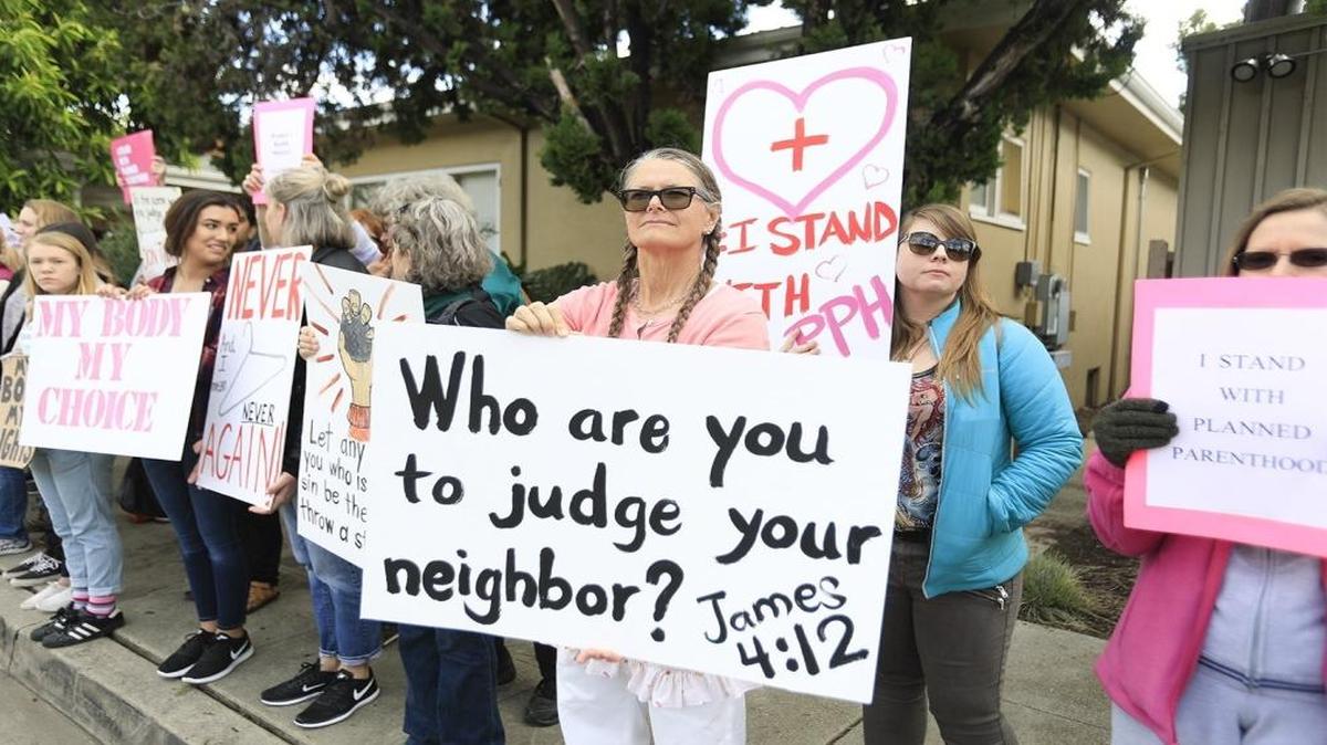 Demonstrators stood outside the San Luis Obispo Planned Parenthood to support the national health care organization, Saturday, February 11, 2017, as a counter-rally to a protest planned by the group #ProtestPP.