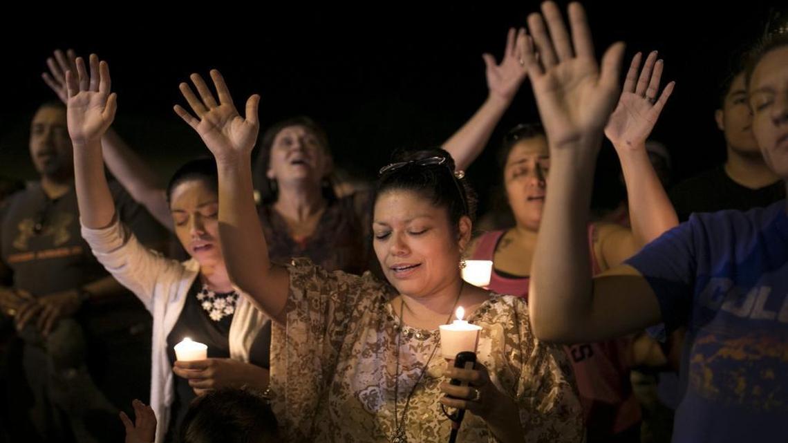 Mourners participate during a candlelight vigil held for the victims of a fatal shooting at the First Baptist Church of Sutherland Springs in Sutherland Springs, Texas.