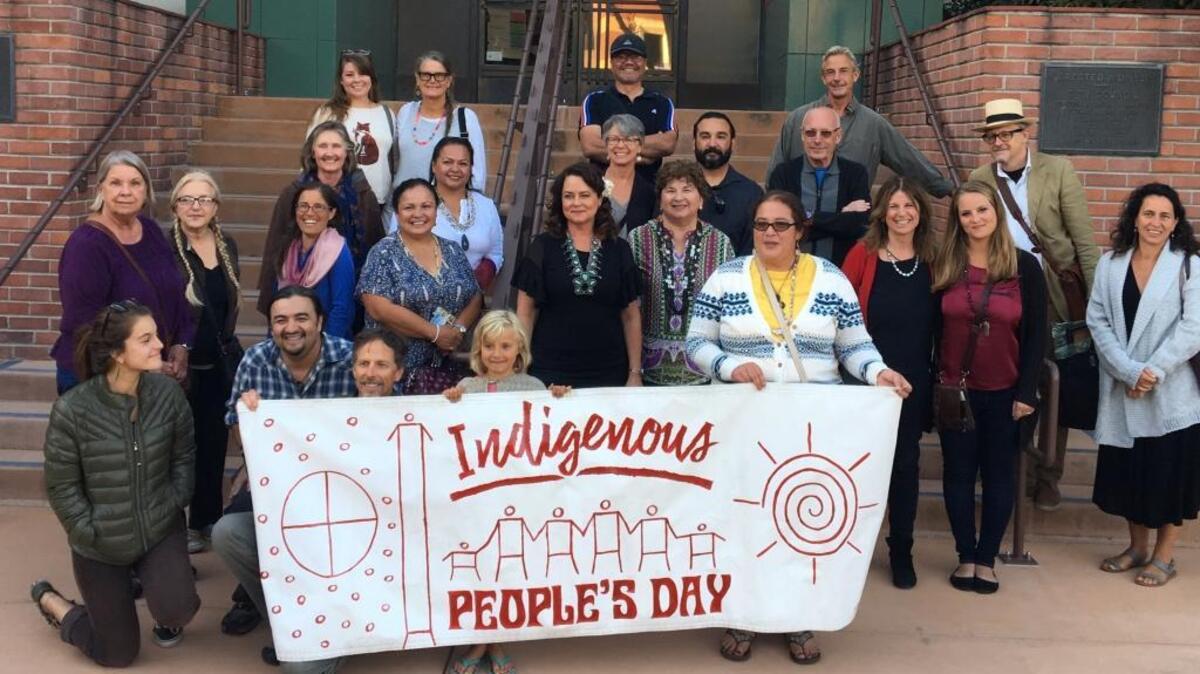 San Luis Obispo Mayor Heidi Harmon, second row center, is joined by members of the Northern Chumash tribe to mark the signing of the Indigenous Peoples Day proclamation.