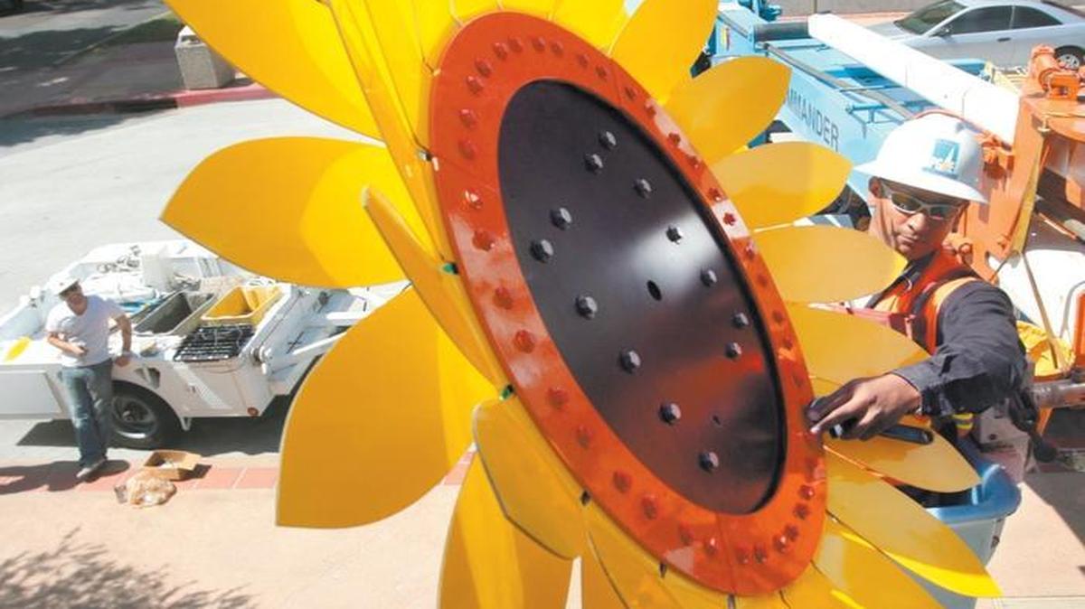 A sunflower outside the Children's Museum in San Luis Obispo includes a solar panel that powers a water fountain. The city of San Luis Obispo is exploring the possibility of transitioning to 100 percent clean energy.