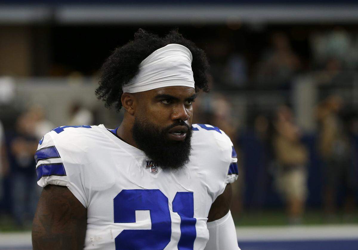 Dallas Cowboys’ Ezekiel Elliott (21) warms up before a NFL football game against the New York Giants in Arlington, Texas, Sunday, Sept. 8, 2019.