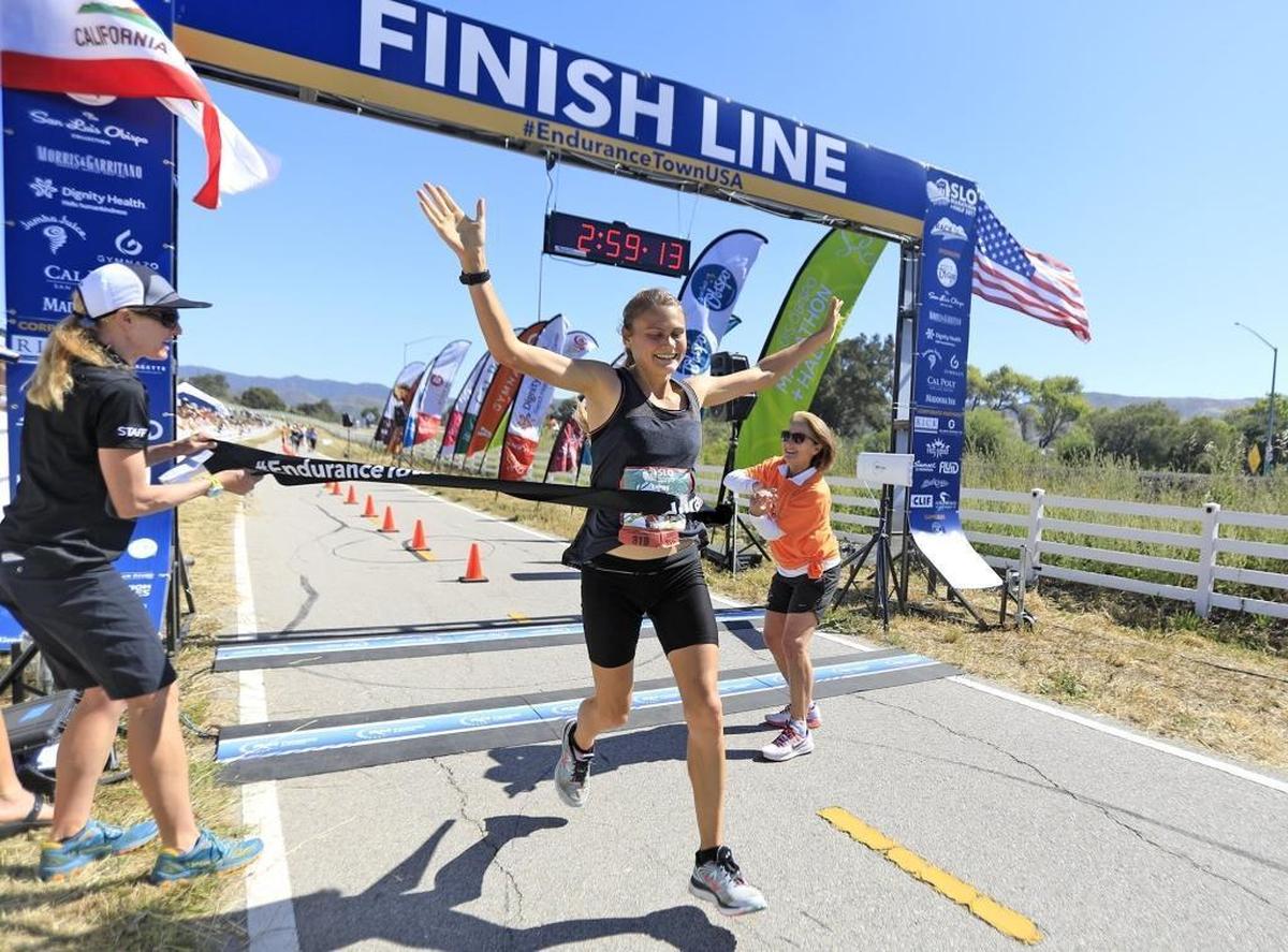 Kelsey Lakowske, 24, crosses the finish line to win the women’s race of the 2017 SLO Marathon in 2 hours, 59 minutes, 8 seconds.