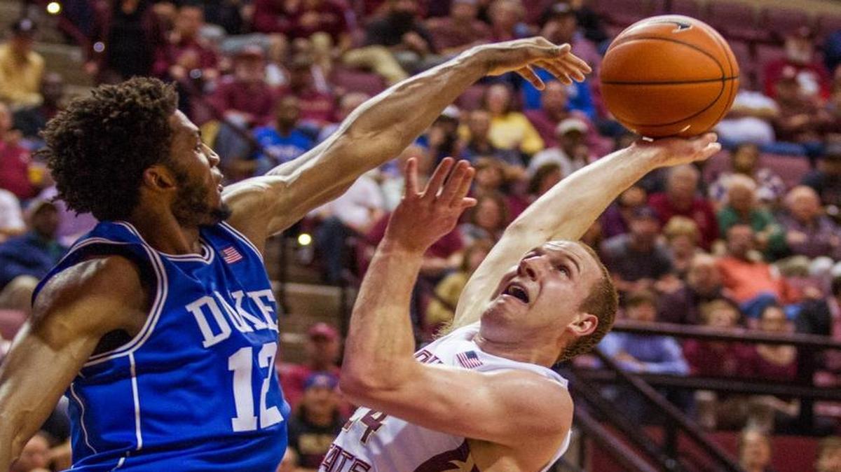 Florida State guard Robbie Berwick scores two against Duke forward Justise Winslow in an NCAA college basketball game in Tallahassee, Fla. in Feb., 2015.