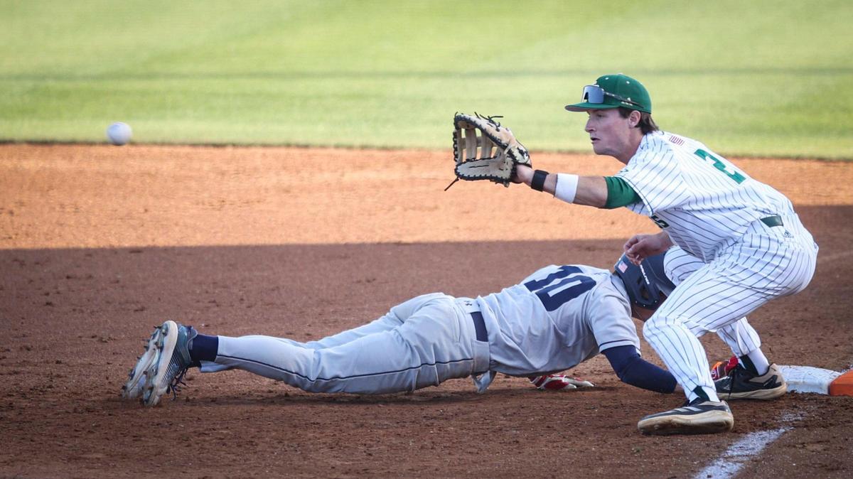 Jake Downing fields pickoff as Cooper Thacker dives back safely. Cal Poly hosted UC San Diego seen here on April 4, 2025.