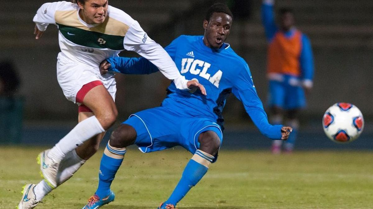 Cal Poly’s Kody Wakasa fights for the ball with UCLA’s Danladi Abu during Thursday night’s 2-0 win by the Bruins.