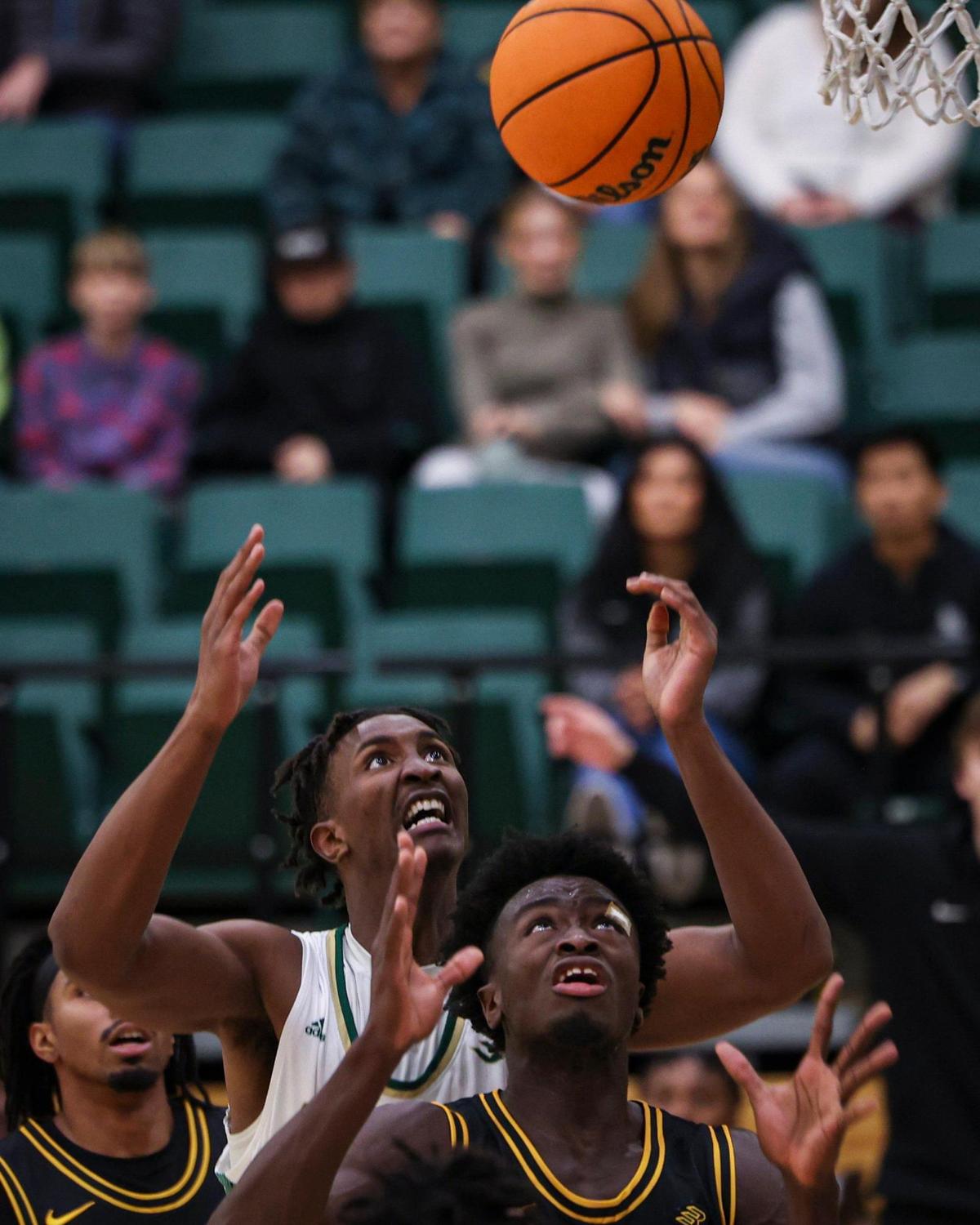 Paul Bizimana with Cal Poly and Aboubacar Traore with Long Beach go up for a rebournd. Long Beach state won 89-82 at Cal Poly’s Mott gym Jan. 4, 2024.