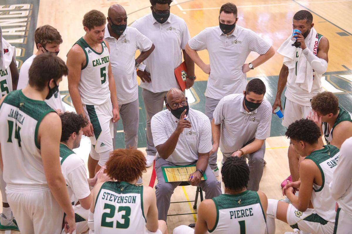 Coach John Smith talks to the team during a time out as Cal Poly hosted UC Riverside for an NCAA men’s basketball game in January 2021.