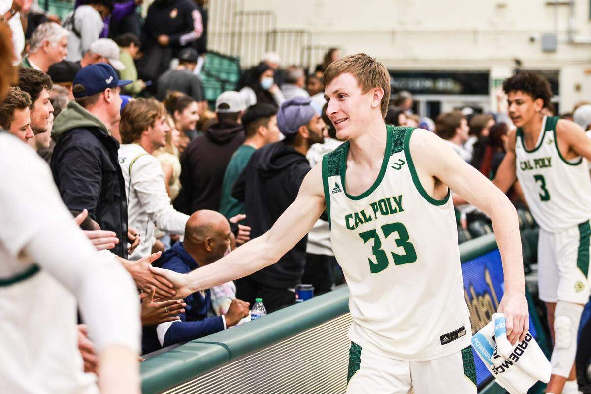 Mission Prep alum Kyle Colvin has returned to the court for Cal Poly after a hip injury kept him out of action earlier this season. Here, he greets fans after a win against UC Irvine on Thursday, March 3, 2022.
