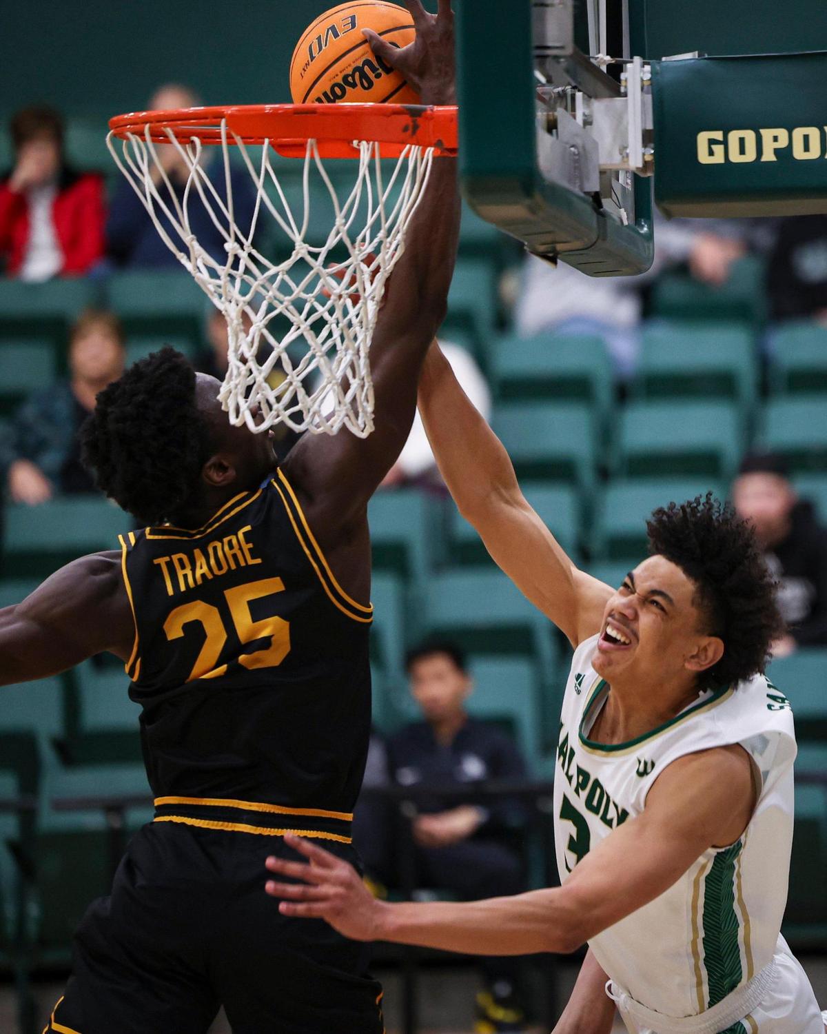 Kobe Sanders is blocked by Aboubacar Traore. Long Beach state won 89-82 at Cal Poly’s Mott gym Jan. 4, 2024.