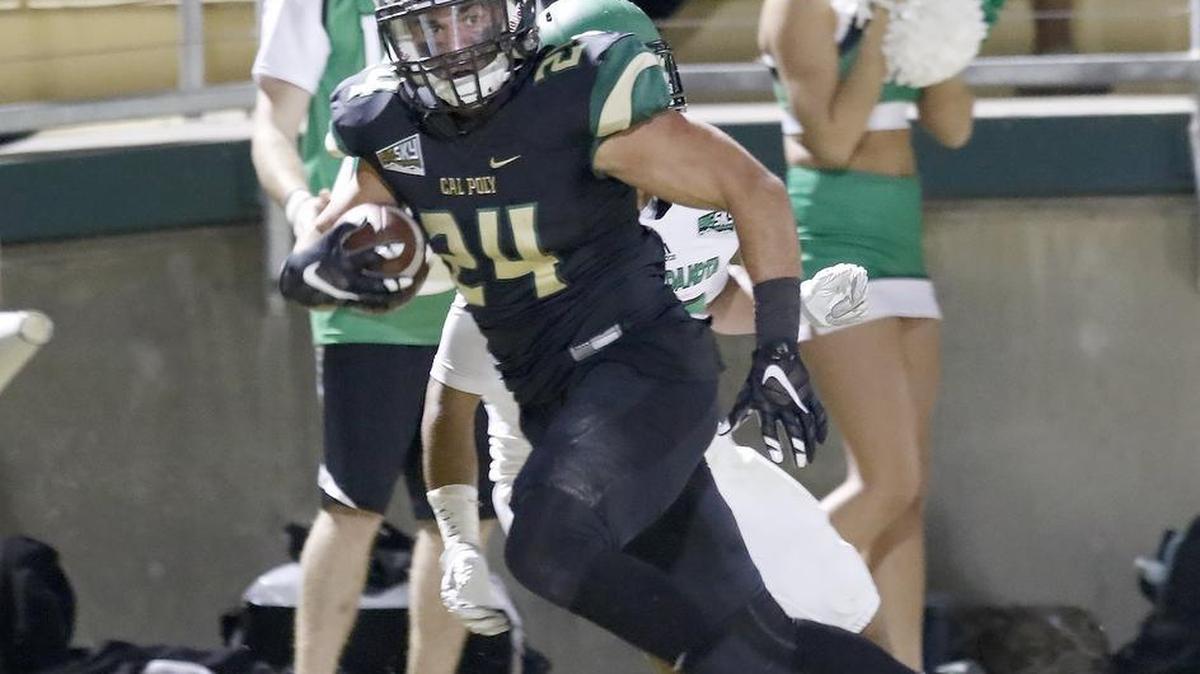 Cal Poly’s Kori Garcia looks to gain yardage during the Mustangs’ loss to North Dakota on Saturday night.