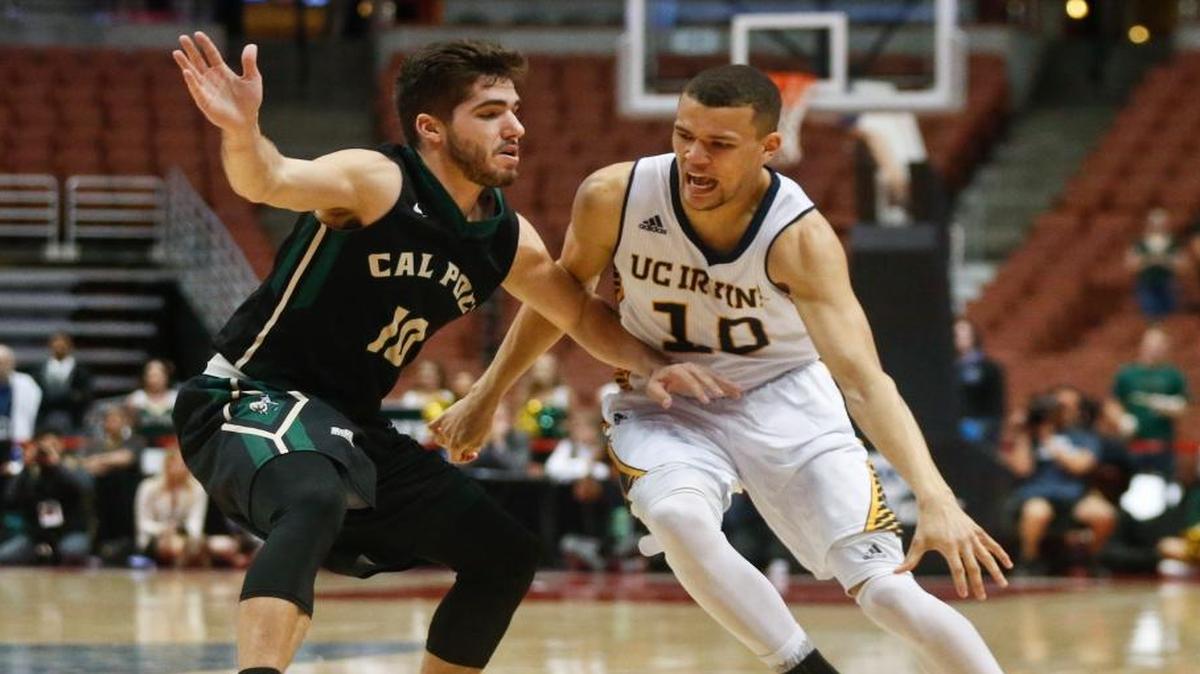 UC Irvine guard Luke Nelson drives around Cal Poly guard Ridge Shipley during last year’s Big West Tournament game in Anaheim. The Mustangs hosts the Anteaters at 7 p.m. Wednesday inside Mott Athletics Center.