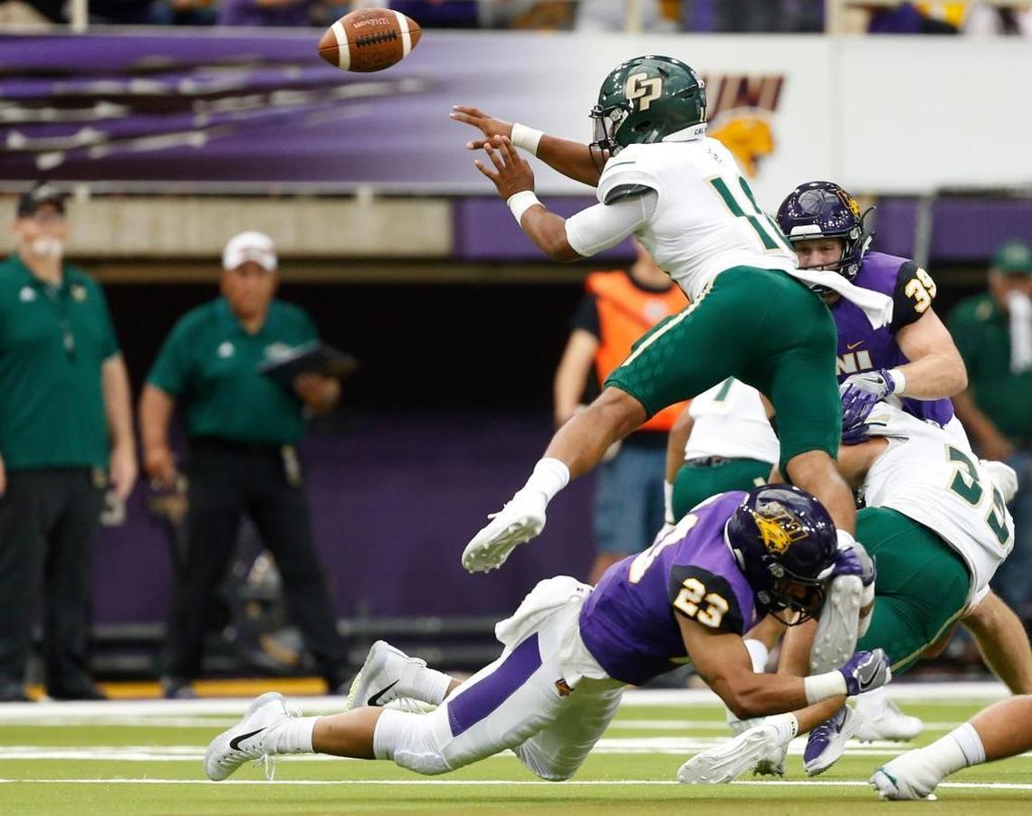 Cal Poly quarterback Khaleel Jenkins, top, tries to get off a pass but Northern Iowa's A.J. Allen helps forces a fumble during the first half of an NCAA college football game Saturday, Sept. 9, 2017, in Cedar Falls, Iowa. (Matthew Putney/The Gazette via AP)