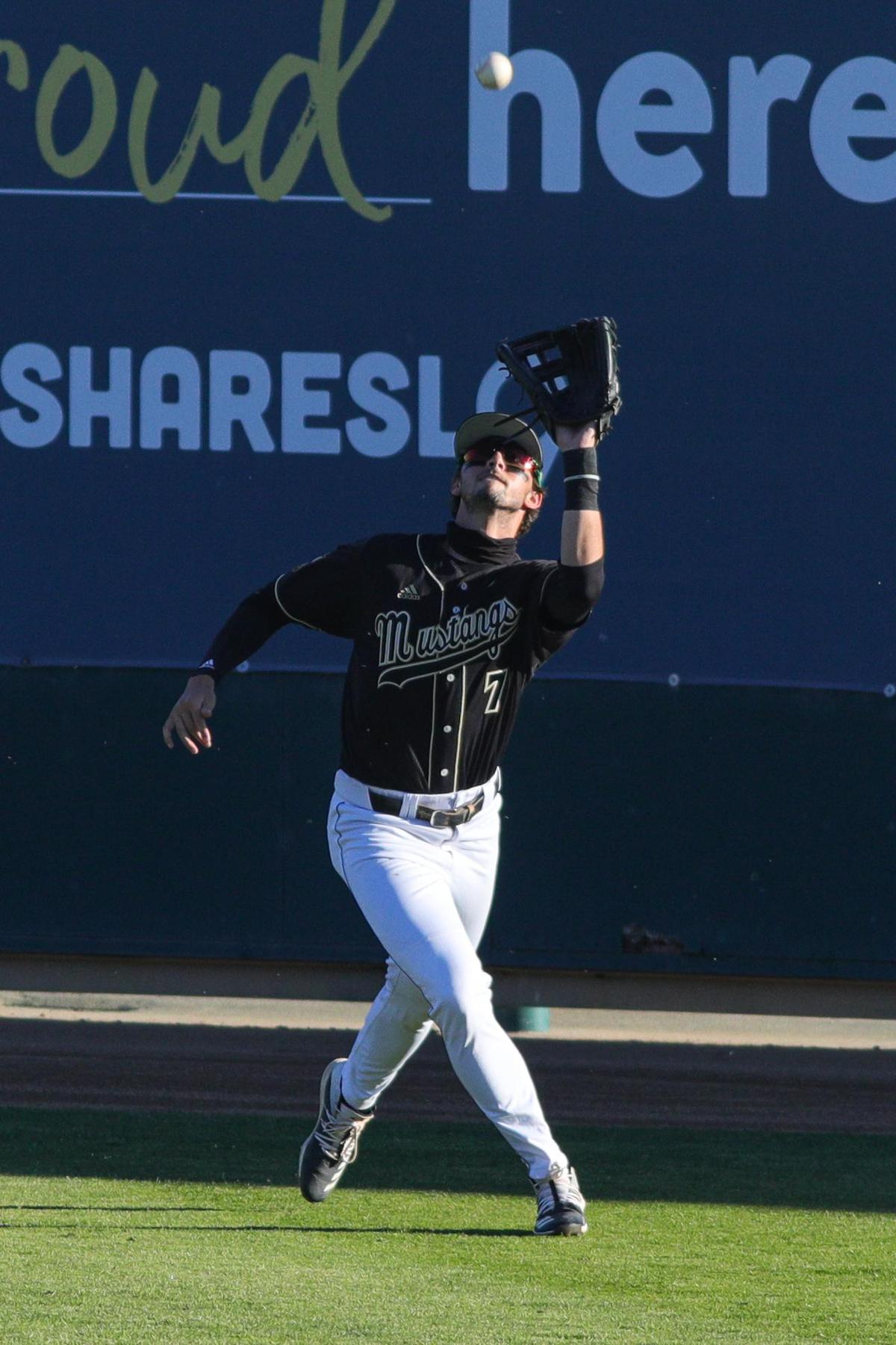 Nick DiCarlo catches a ball in right field. Cal Poly hosted Nevada for a four-game baseball series to open the 2021 season.