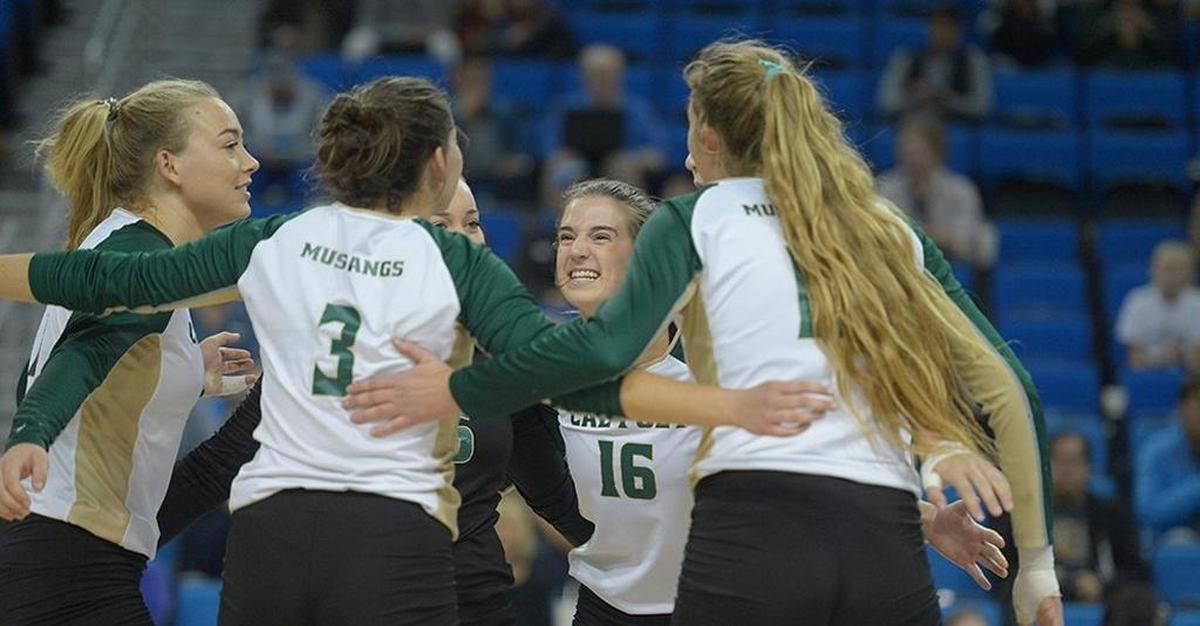 Cal Poly senior Raeann Greisen (center) celebrates with her teammates during a win against Denver in the first round of the NCAA Tournament.