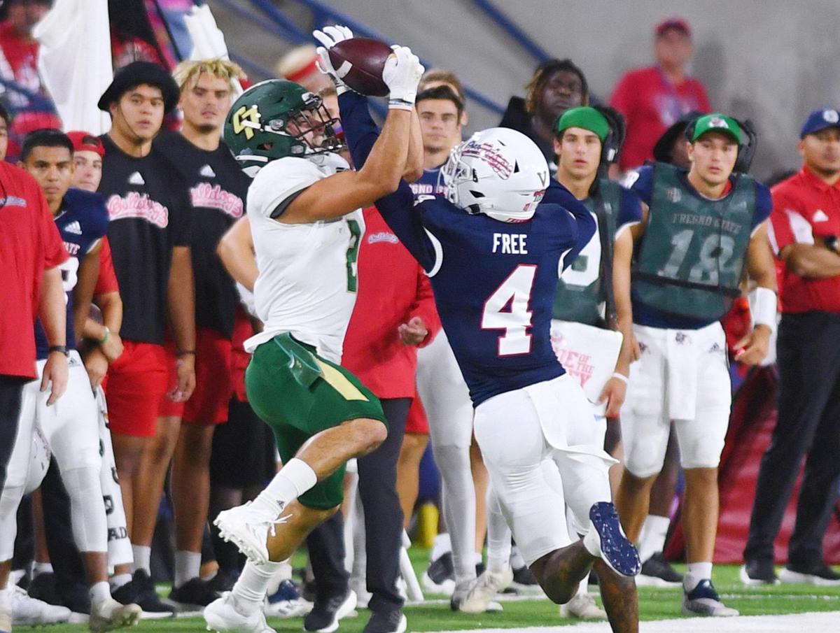 Fresno State’s Wylan Free, right, breaks up a pass to Cal Poly’s Giancarlo Woods, left, Saturday, Sept. 11, 2021 in Fresno.