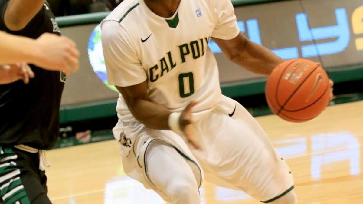 Cal Poly’s David Nwaba looks to get past Hawaii’s Aaron Valdes on Saturday night at Mott Athletics Center. The Mustangs lost 75-60.