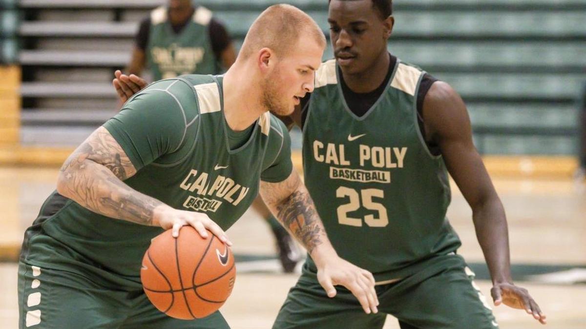 Brian Bennett, left and Joel Awich in defensive drill at Cal Poly basketball practice.