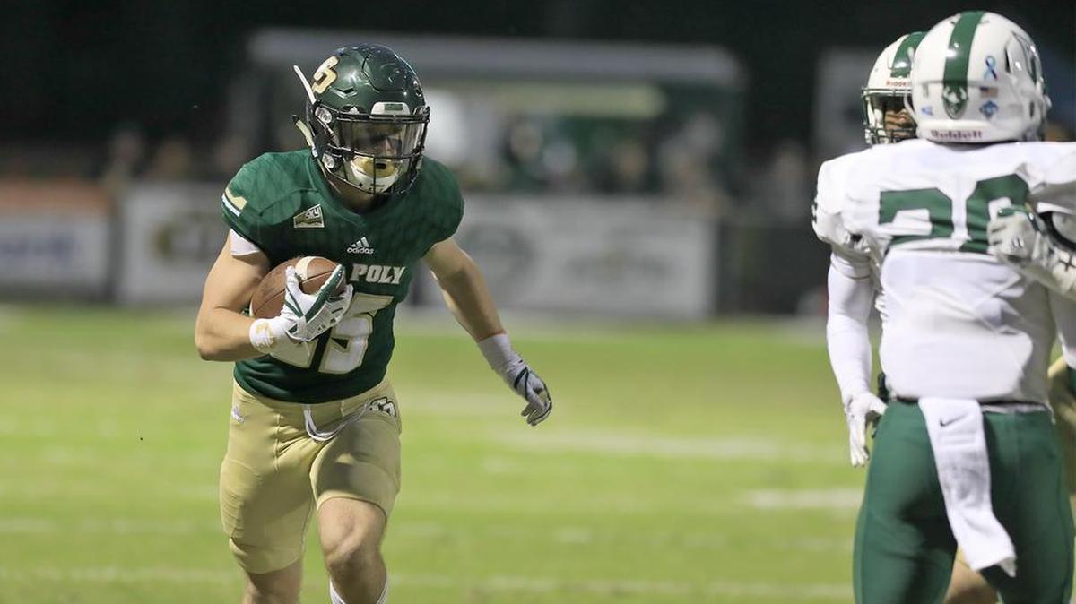Cal Poly’s Brock Mortensen (25) catches a pass and runs down field in the Mustangs’ Homecoming game against Portland State on Saturday at Alex G. Spanos Stadium. The two Big Sky Conference teams were both winless coming into the contest. For coverage, visit sanluisobispo.com/sports or check Monday’s Sports section.