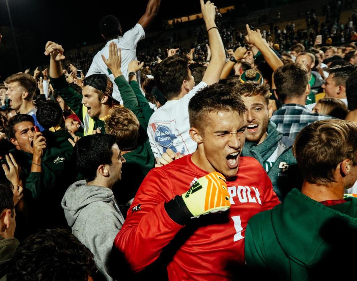 Cal Poly goalkeeper Simon Boehme celebrates with fans at Alex G. Spanos Stadium after the Mustangs beat beat UCSB 1-0 in front of a sellout crowd in their Blue-Green rivalry series opener Sunday, Sept. 30, 2018.