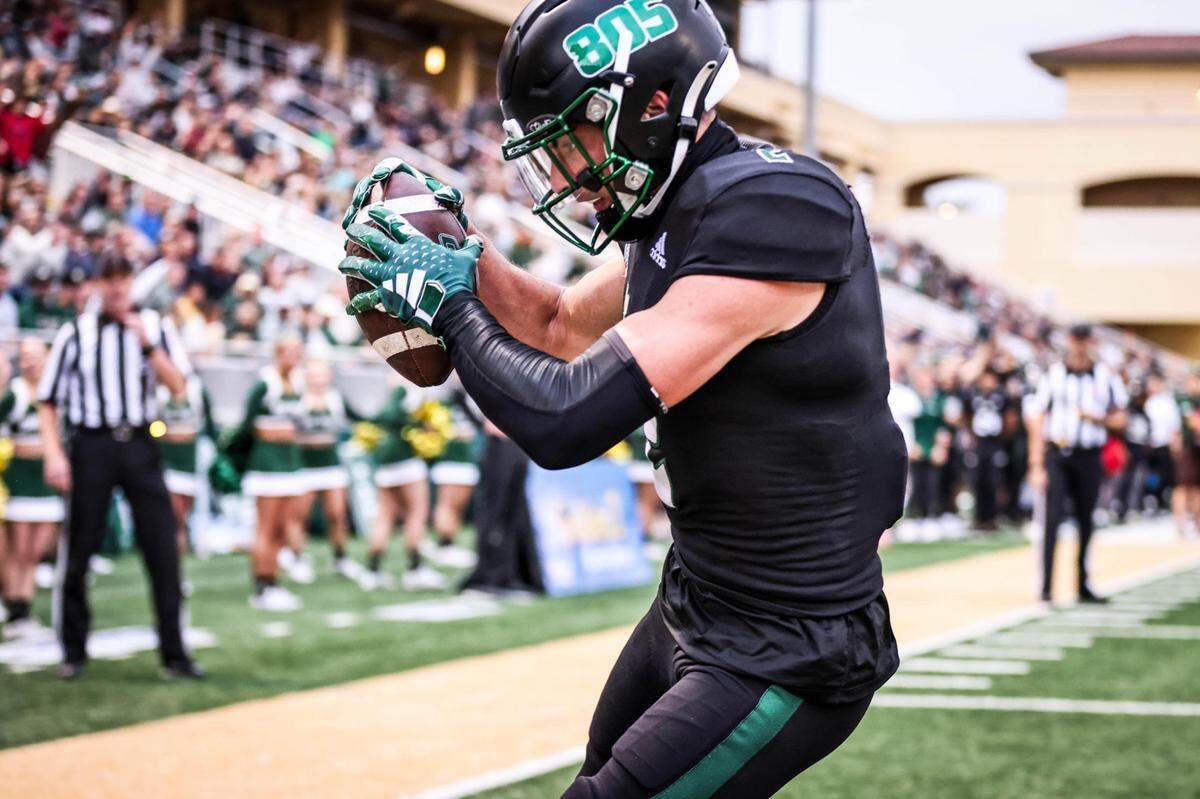 Cal Poly Mustangs wide receiver Giancarlo Woods (2) catches a touchdown pass. The Cal Poly footballl team beat Lincoln 41-20 at home on Sept. 16, 2023. 