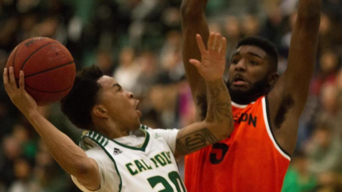 Cal Poly's Victor Joseph (left) drives against Princeton's Amir Bell in a nonconference game Saturday at Mott Athletic Center.