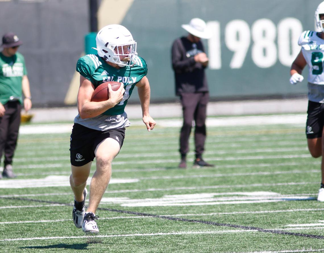 Logan Ast, a running back, makes a play at a recent Cal Poly Mustangs practice game.
