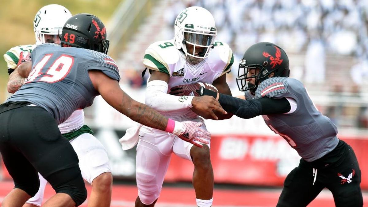 Cal Poly quarterback Chris Brown (9) runs the ball through Eastern Washington’s line for a first down during the Mustangs’ game earlier this month at Roos Field in Cheney, Wash.