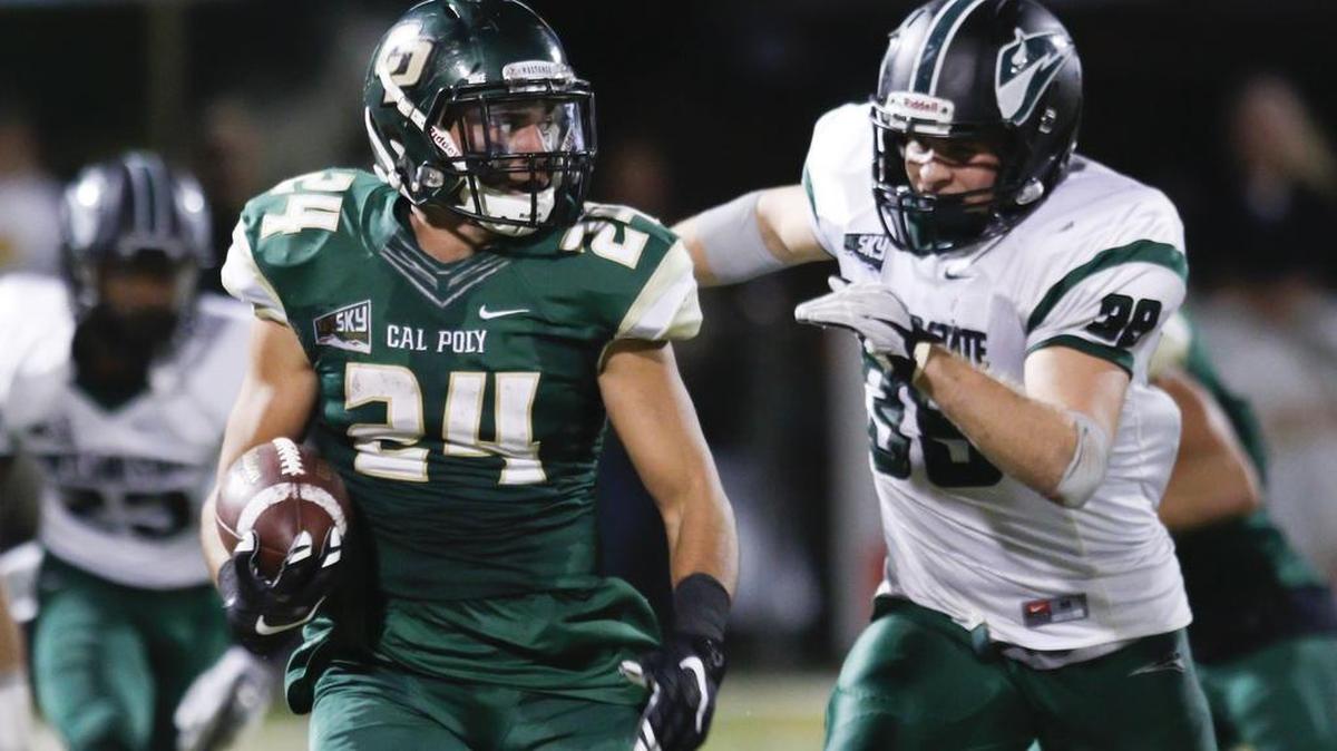 Kori Garcia of Cal Poly broke for a big gain pursued by Portland State’s Xavier Coleman.