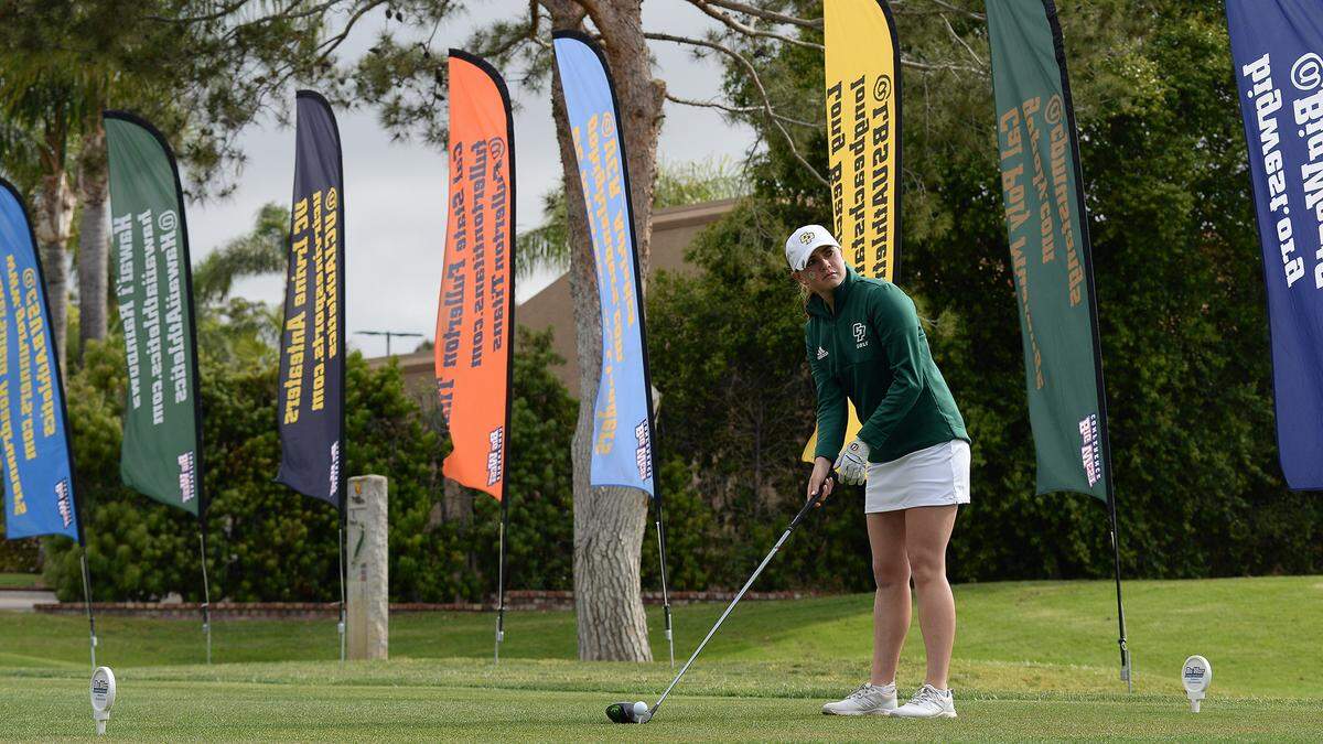 Cal Poly golfer Caroline Cantlay lining up a tee shot.