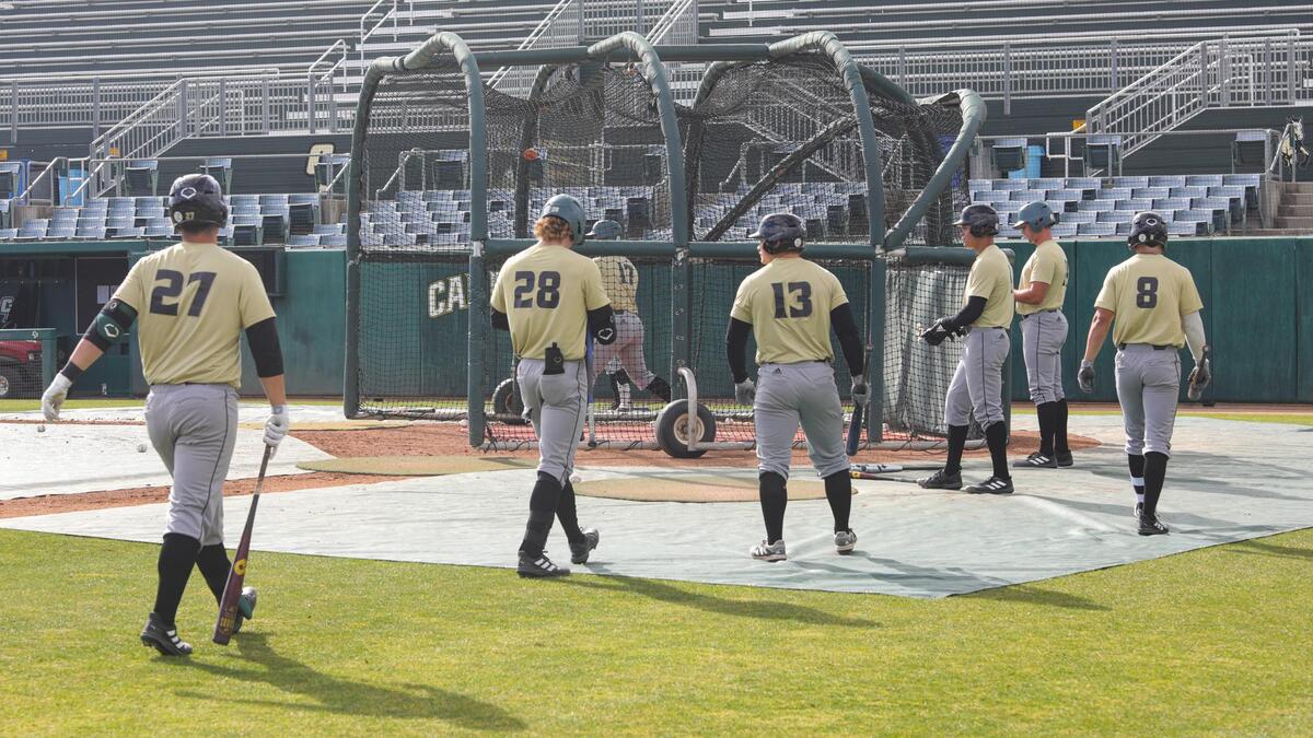 Cal Poly baseball players line up for batting practice on Feb. 16, 2022, in preparation for the season opener.