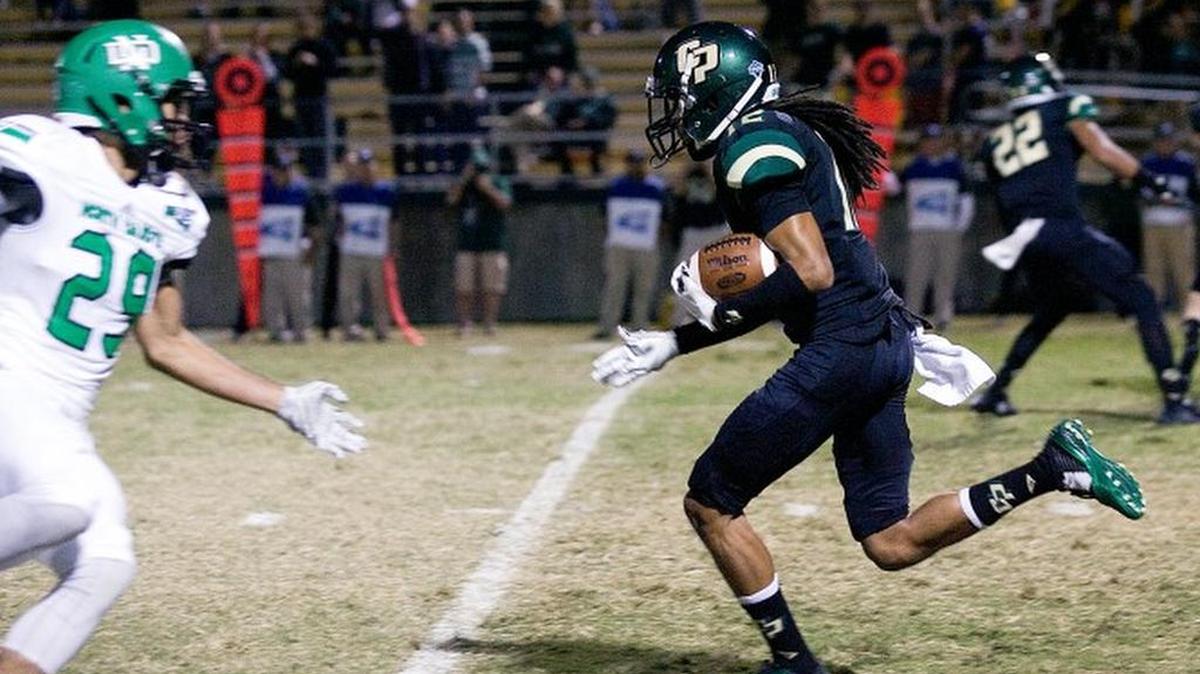 Cal Poly receiver Roland Jackson Jr. (12) gains yardage in the first few minutes of the game. North Dakota was winning 28-0 at halftime in the Mustangs’ season finale.