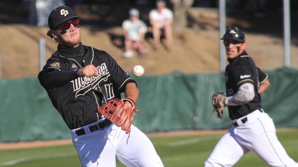 Tate Samuelson throws to first for an out as Brooks Lee rotates over to cover third. Cal Poly hosted Nevada for a 4 game baseball series to open the season. Fans are expected to return after April 1.
