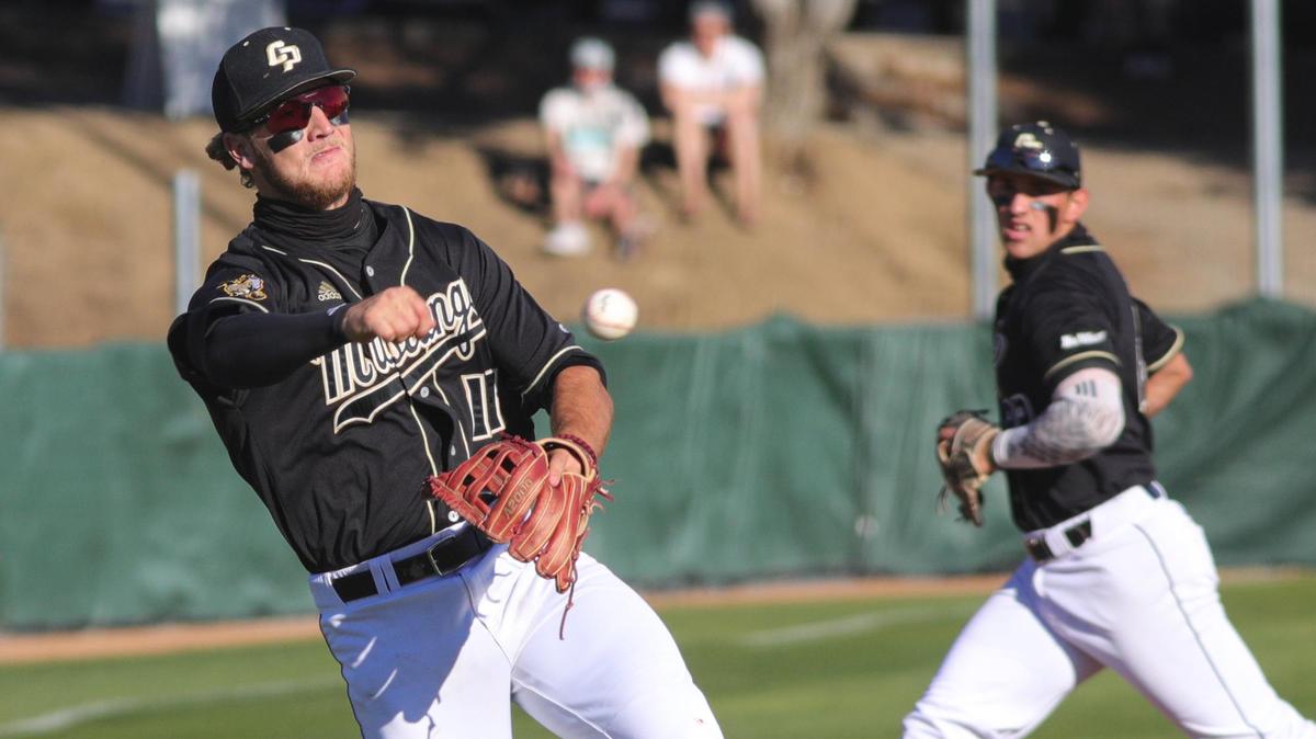 Tate Samuelson throws to first for an out as Brooks Lee rotates over to cover third. Cal Poly hosted Nevada for a 4-game baseball series to open the 2021 season.