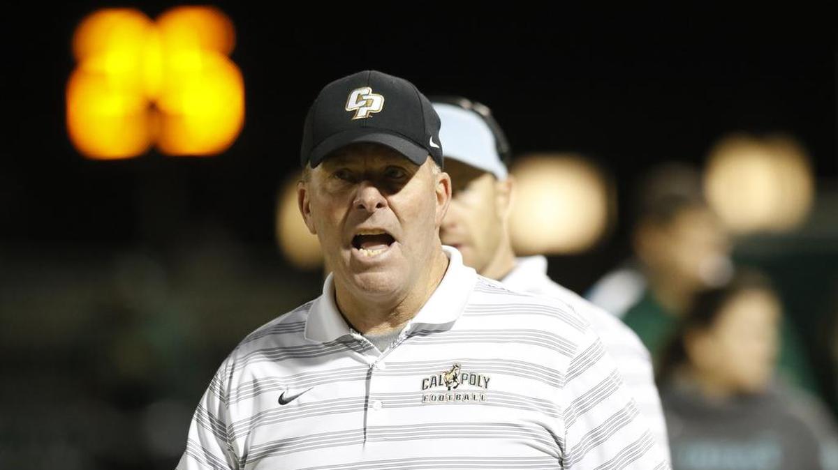 Cal Poly head coach Tim Walsh walks the sideline during the Mustangs’ win against Sacramento State last Saturday at Alex G. Spanos Stadium.