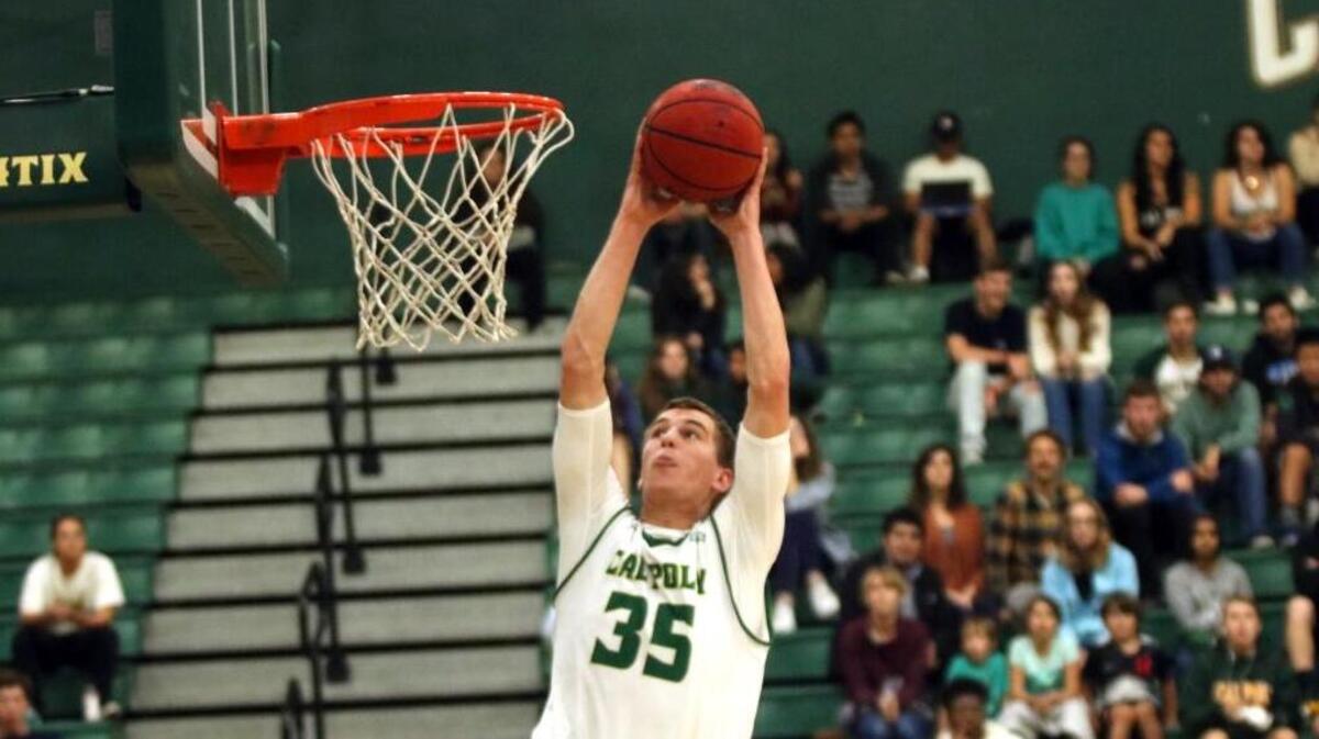Junior forward and Poland native Jakub Niziol goes up for the dunk in the Cal Poly men’s basketball team’s win Wednesday over Holy Names.