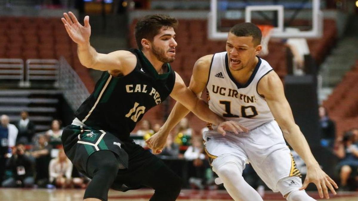 Cal Poly guard Ridge Shipley defends UC Irvine guard Luke Nelson during last year’s Big West Tournament in Anaheim. The Mustangs are scheduled to play UC Davis at noon Thursday in the first round.